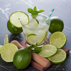 A chilled caipirinha with fresh limes and ice, perfect summer cocktail.